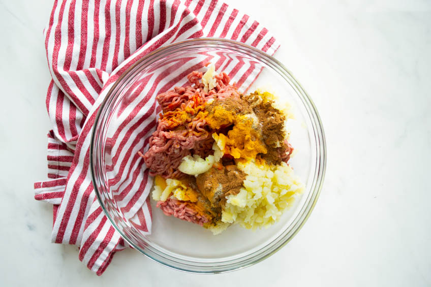 Beef kotlet ingredients in a mixing bowl