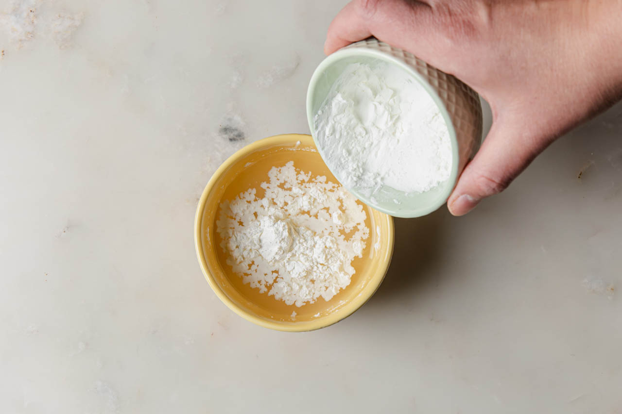 Water and cornstarch being mixed for a cornstarch slurry