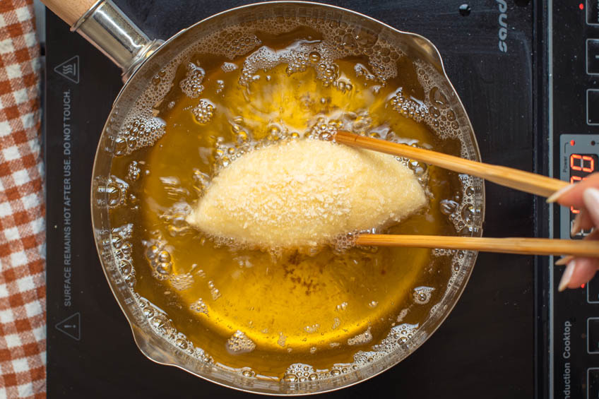 Japanese curry bread being deep fried