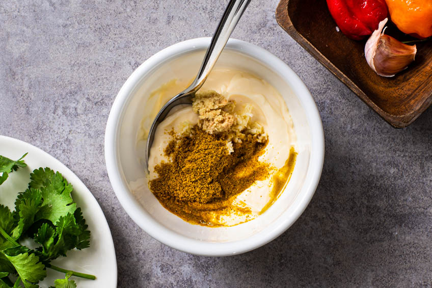 Curried aioli ingredients in a bowl