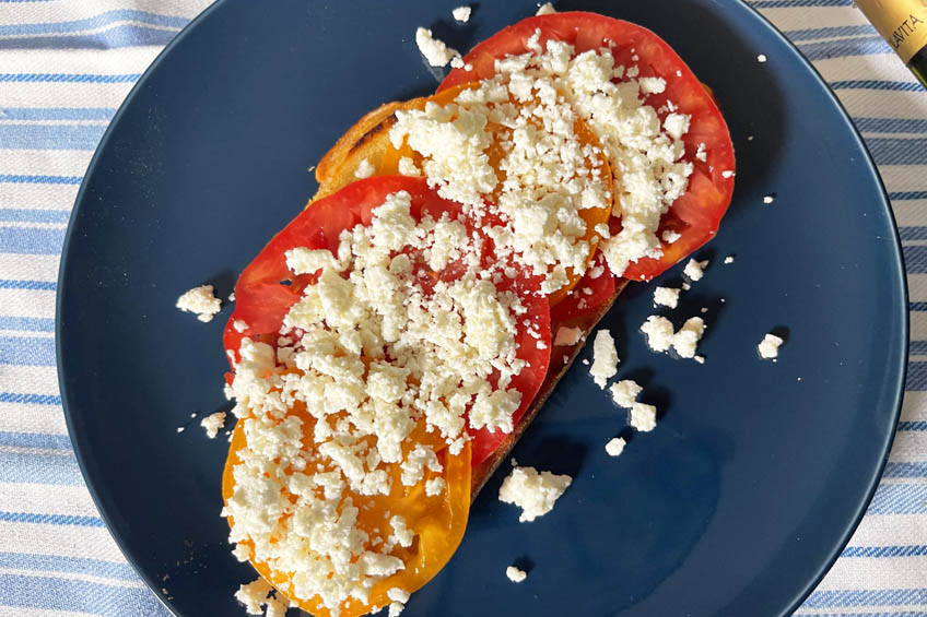 Toast topped with tomatoes and feta