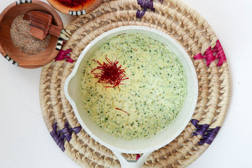 Saffron pistachio kulfi popsicle mixture in a pot