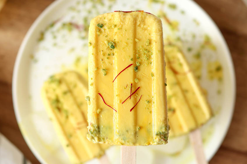 A closeup on saffron pistachio popsicles