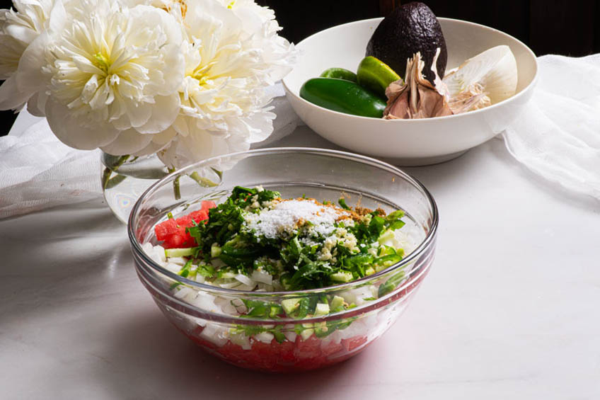 Watermelon pico de gallo ingredients in a bowl