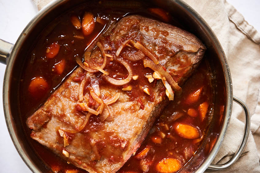 Brisket simmering in a Dutch oven