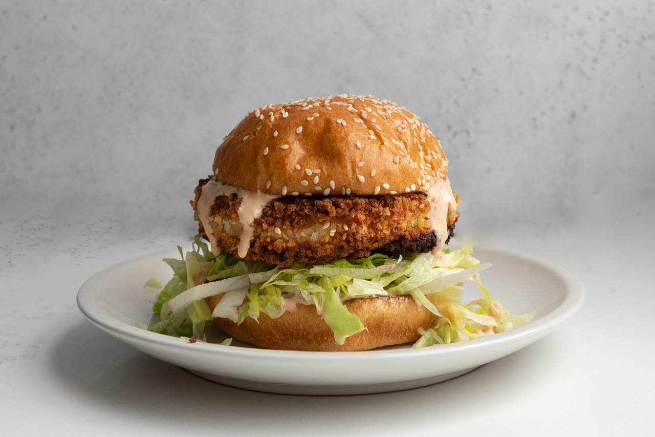 Chicken tonkatsu burger on a plate