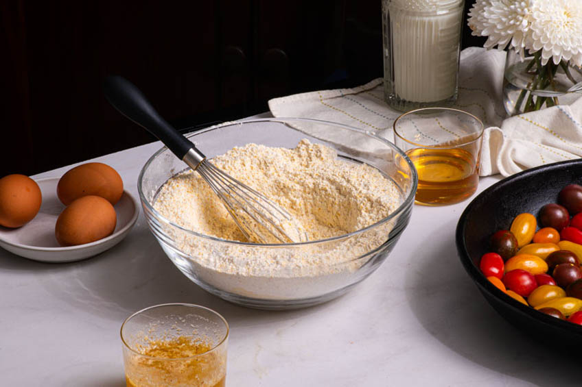 Dry cornbread ingredients in a bowl