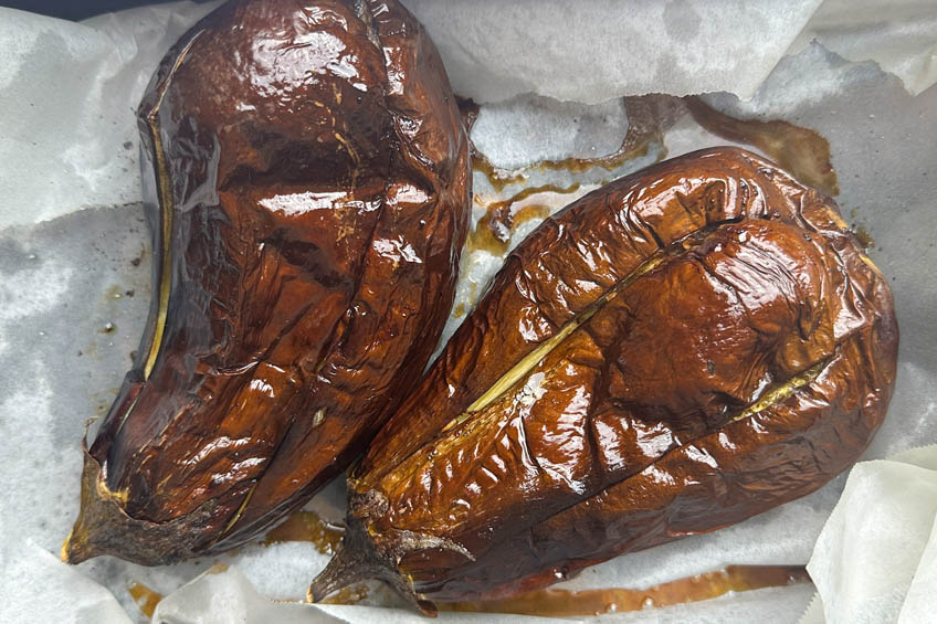 Roasted eggplant on a baking tray