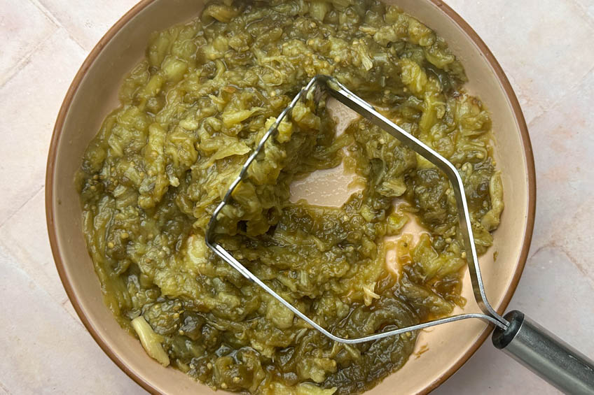 Roasted eggplant mashed in a bowl