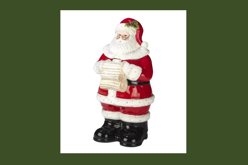 Santa-shaped cookie jar reading a list