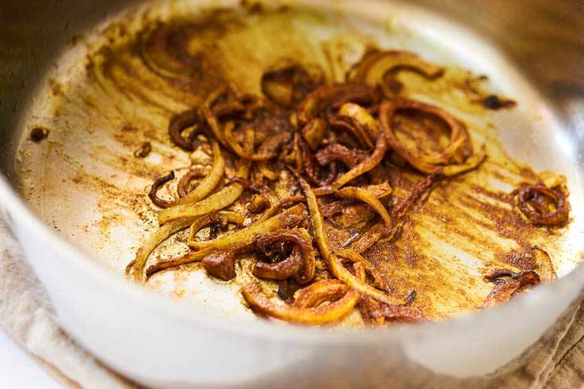 Onions and spices in a pan