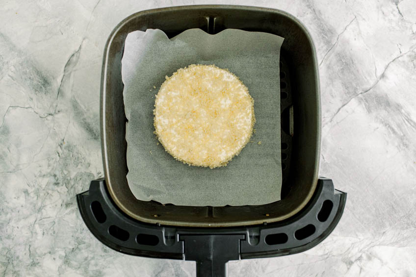 Dredged Brie wheel in air fryer basket