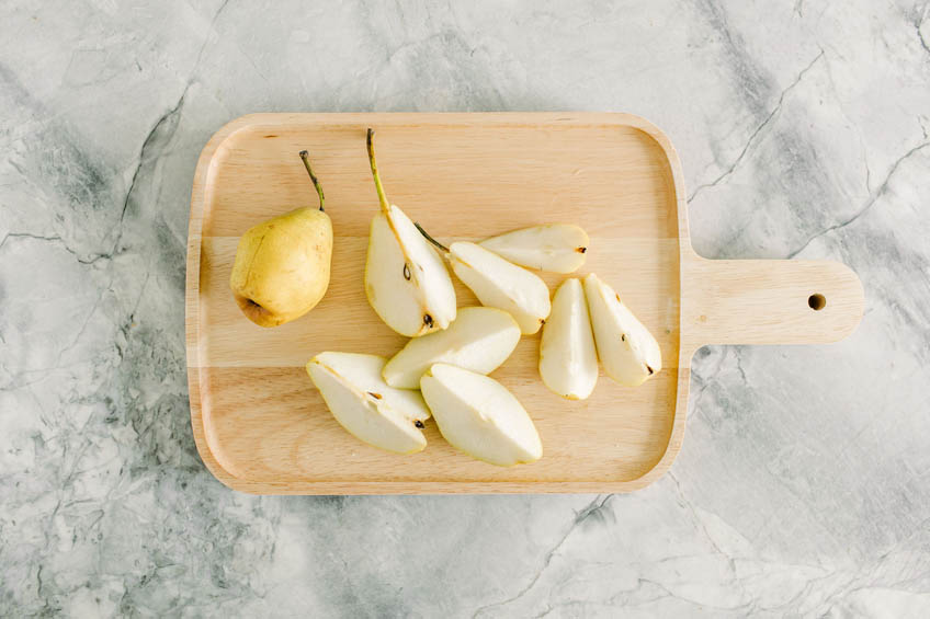 Pears being cut and cored