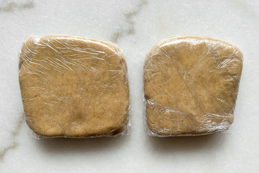 Cookie dough discs wrapped in plastic wrap