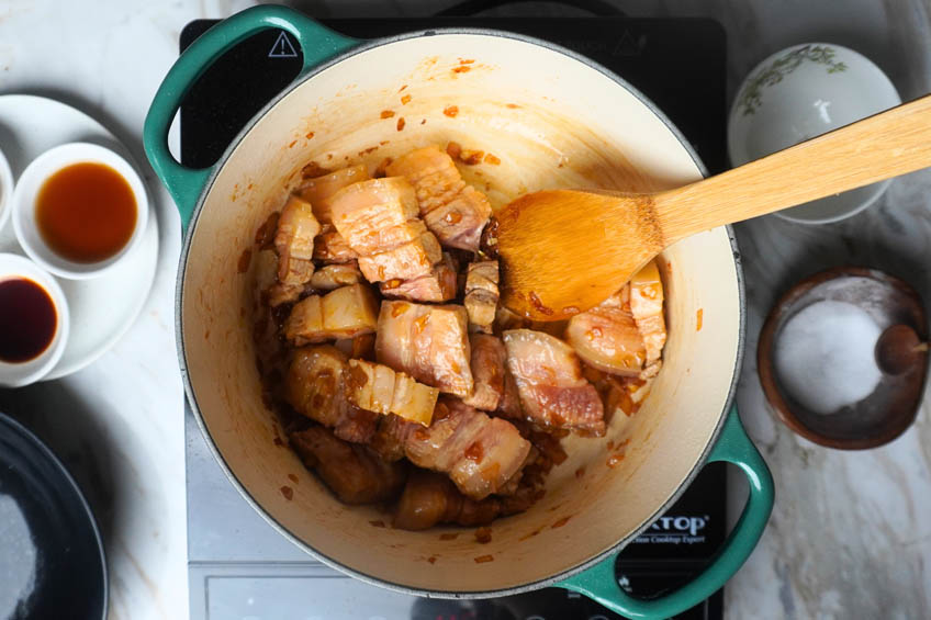 Pork belly added to Dutch oven