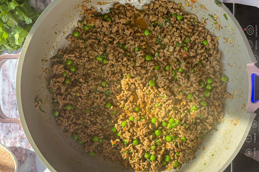 Beef cooked down in pan