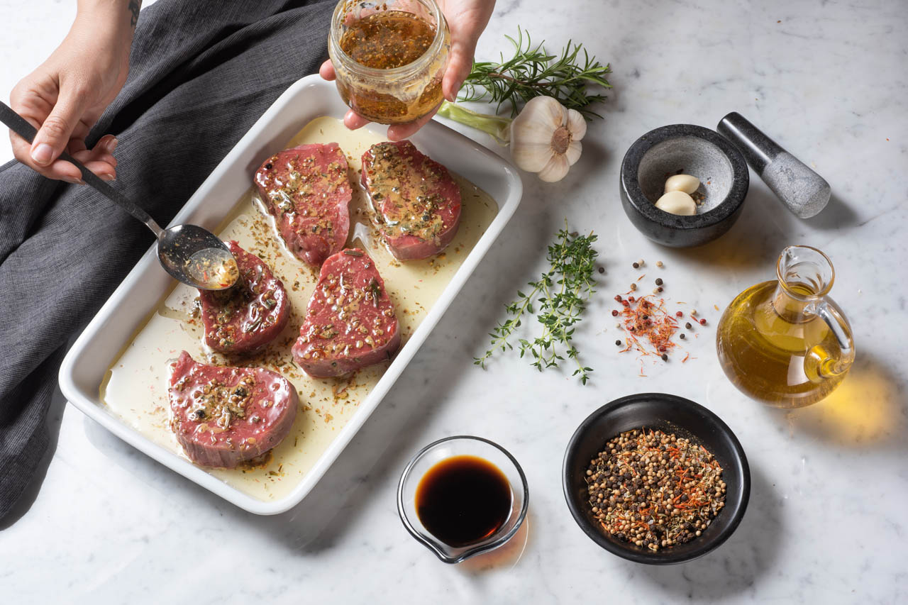 Steaks being marinated