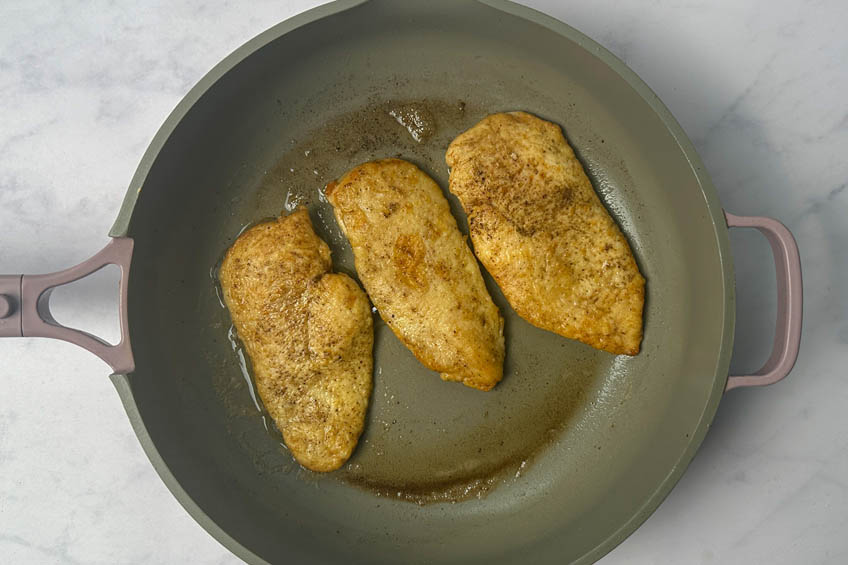 Cooked chicken in a skillet