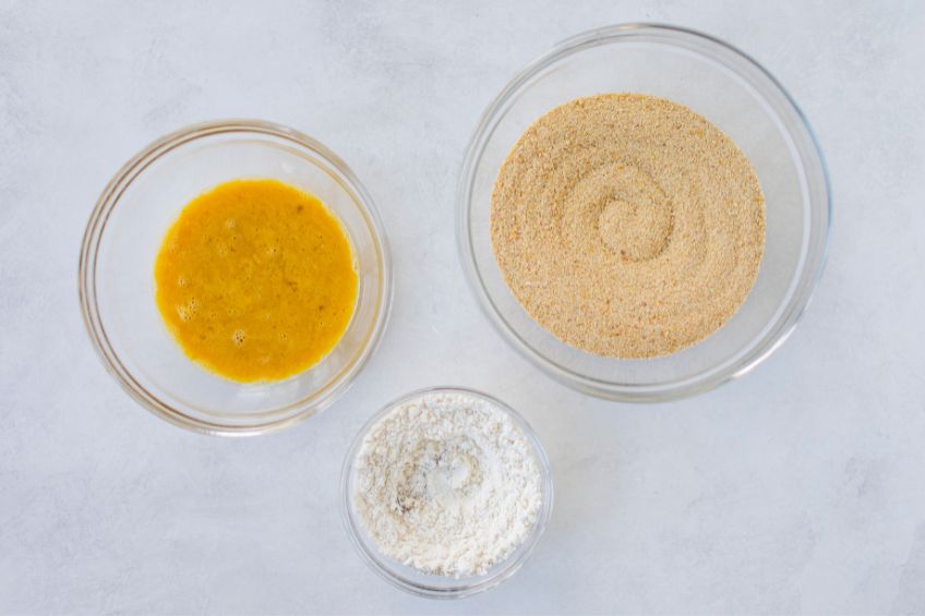 Eggs, flour and bread crumbs in separate bowls