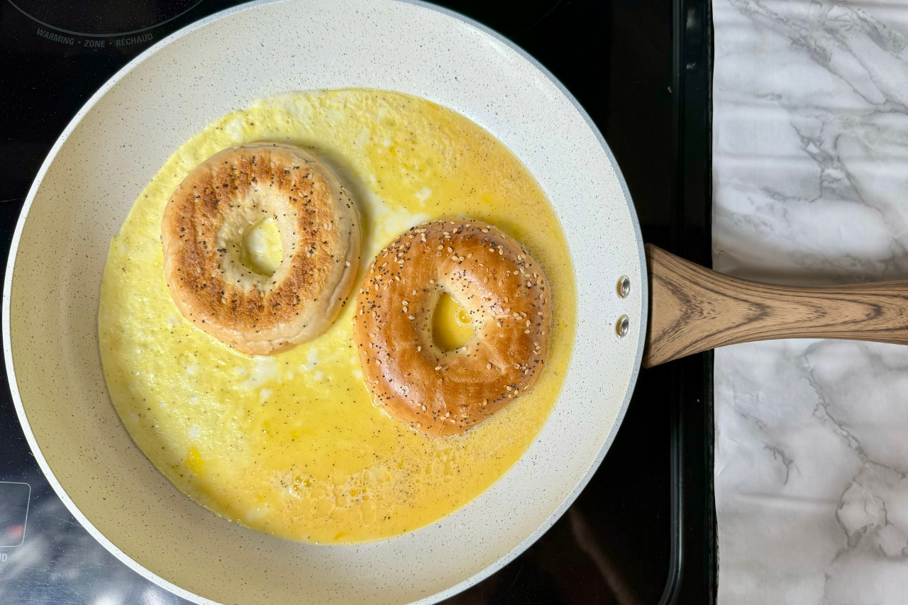 eggs and bagel on a pan