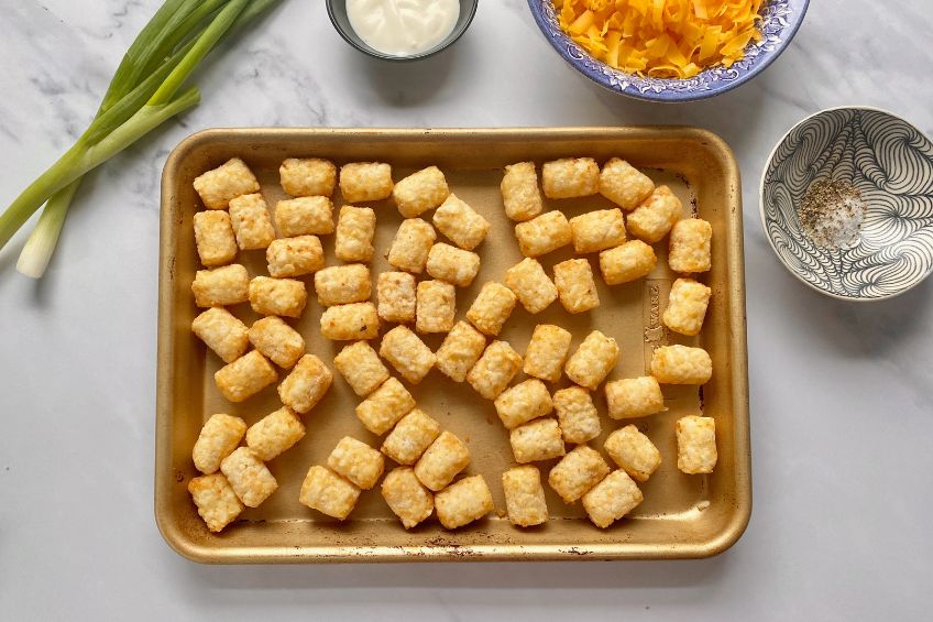 Tater tots on a baking sheet