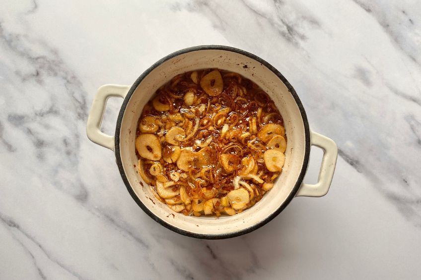 Fried shallots and garlic in a small saucepan of oil