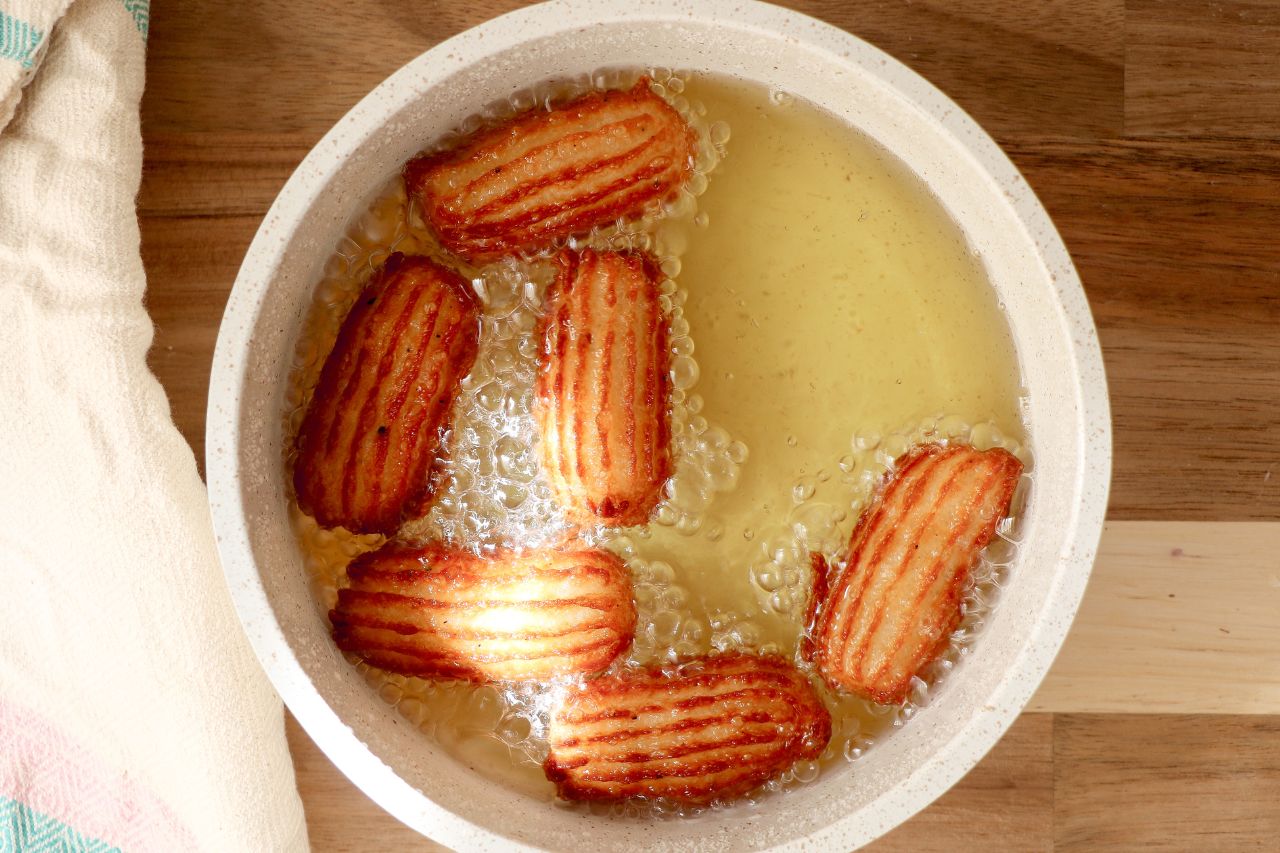 Gulab Jamun Churros cooking in oil