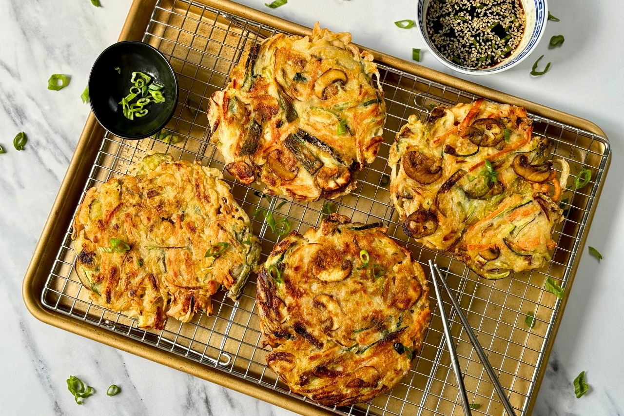 Korean vegetable pancakes (yachaejeon) on a cooling rack