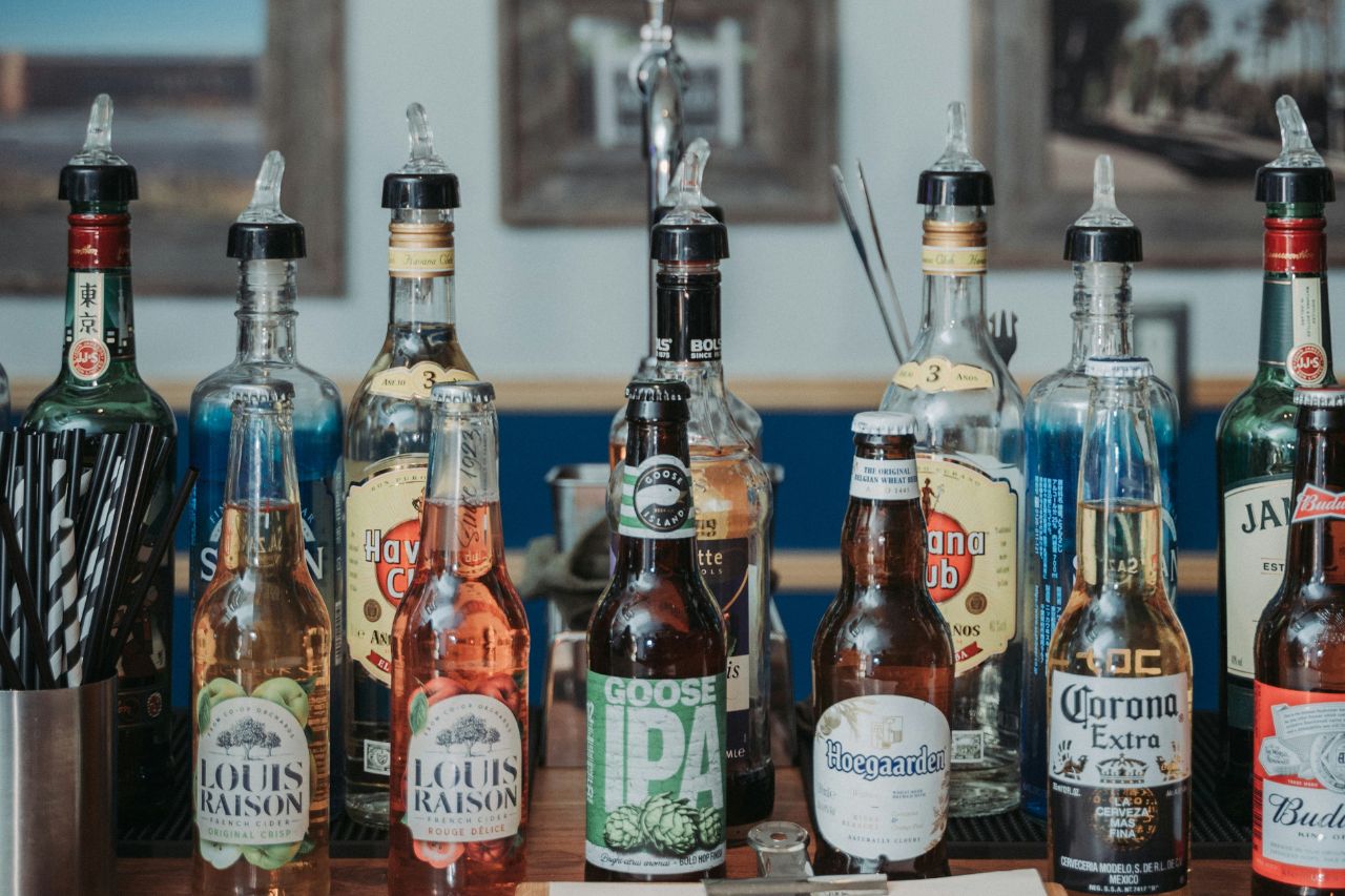 Alcohol liquors and spirits bottles on a bar top