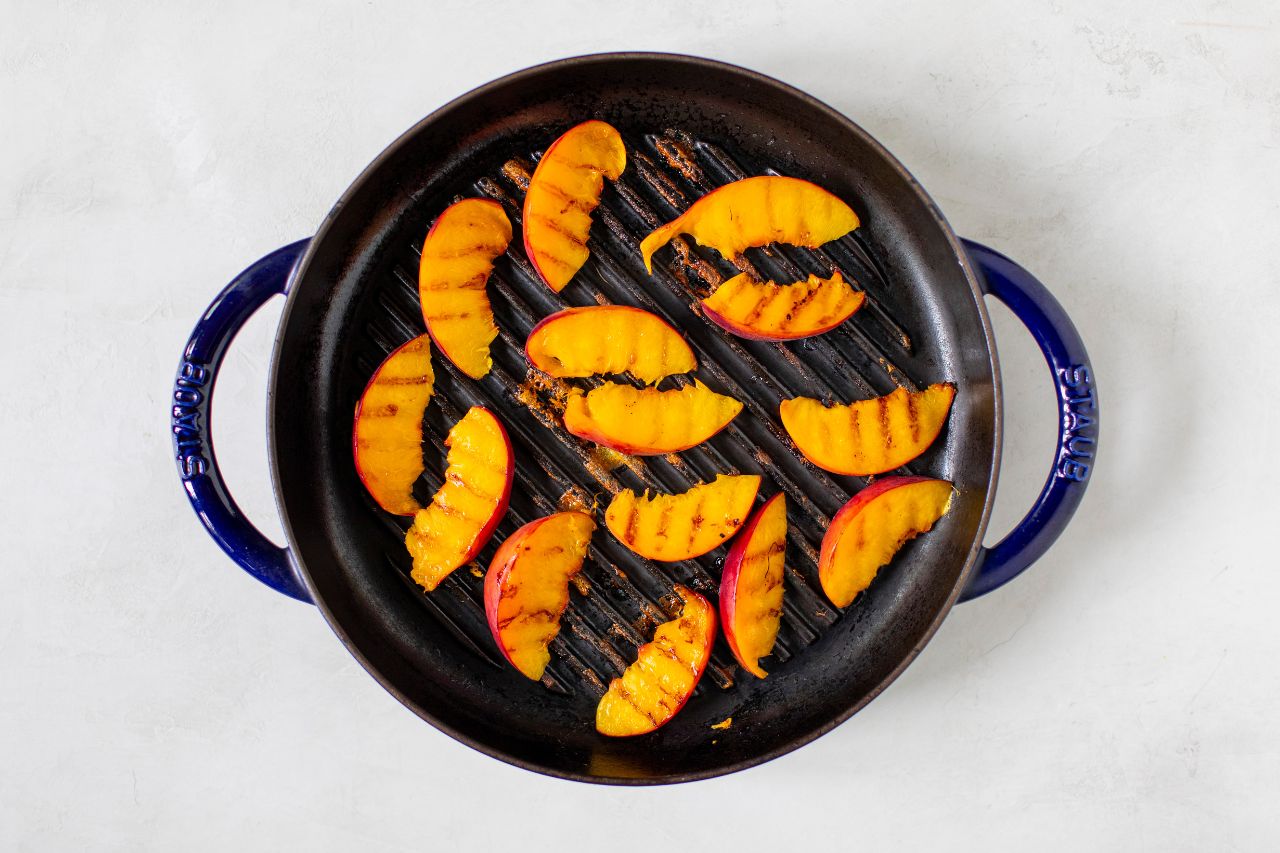 Grilled peaches on a BBQ