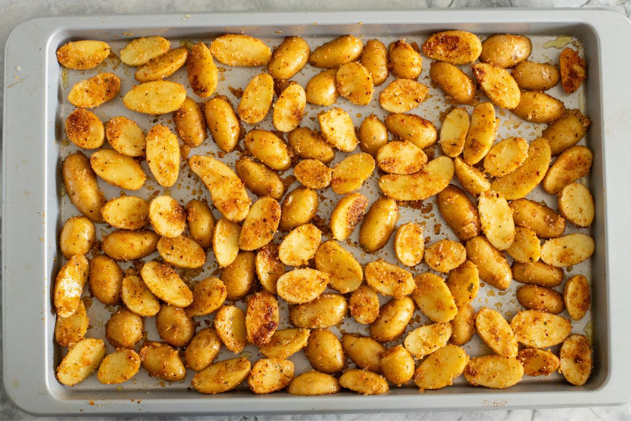 Parmesan potatoes on a baking sheet