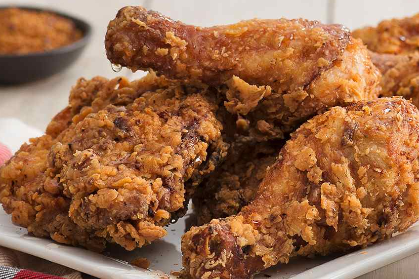 Golden fried chicken drumsticks and thighs