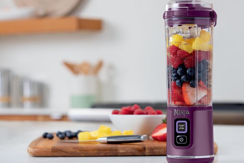 Ninja portable blender in purple on kitchen counter