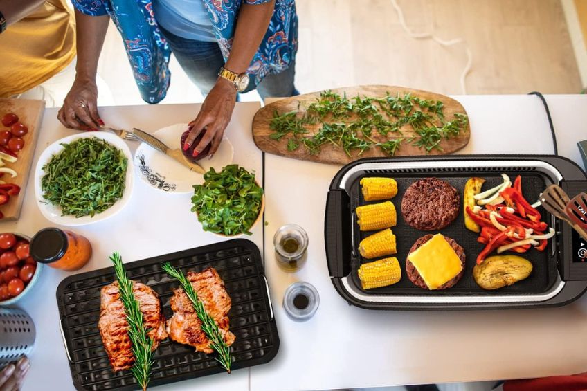 Woman prepping ingredients for the Cusimax indoor grill