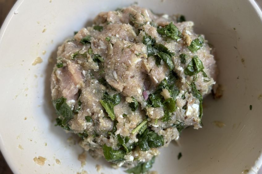 feta and spinach meatballs in the mixing bowl