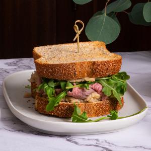 Hot Leftover Prime Rib Sandwich with Smashed Horseradish White Beans