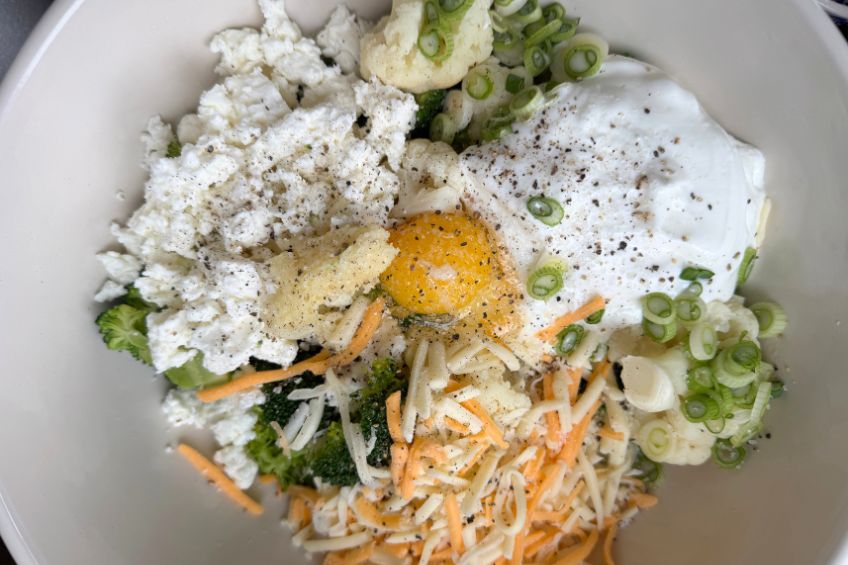 Broccoli and cauliflower casserole ingredients in a bowl