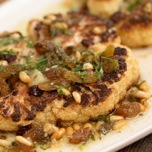 Cauliflower Steak With Raisin, Pine Nut and Capers Sauce