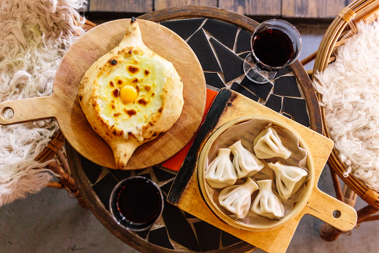 Traditional Georgian dinner with khachapuri and khinkali