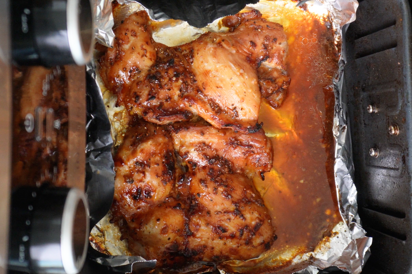 Marinated chicken in an air fryer basket