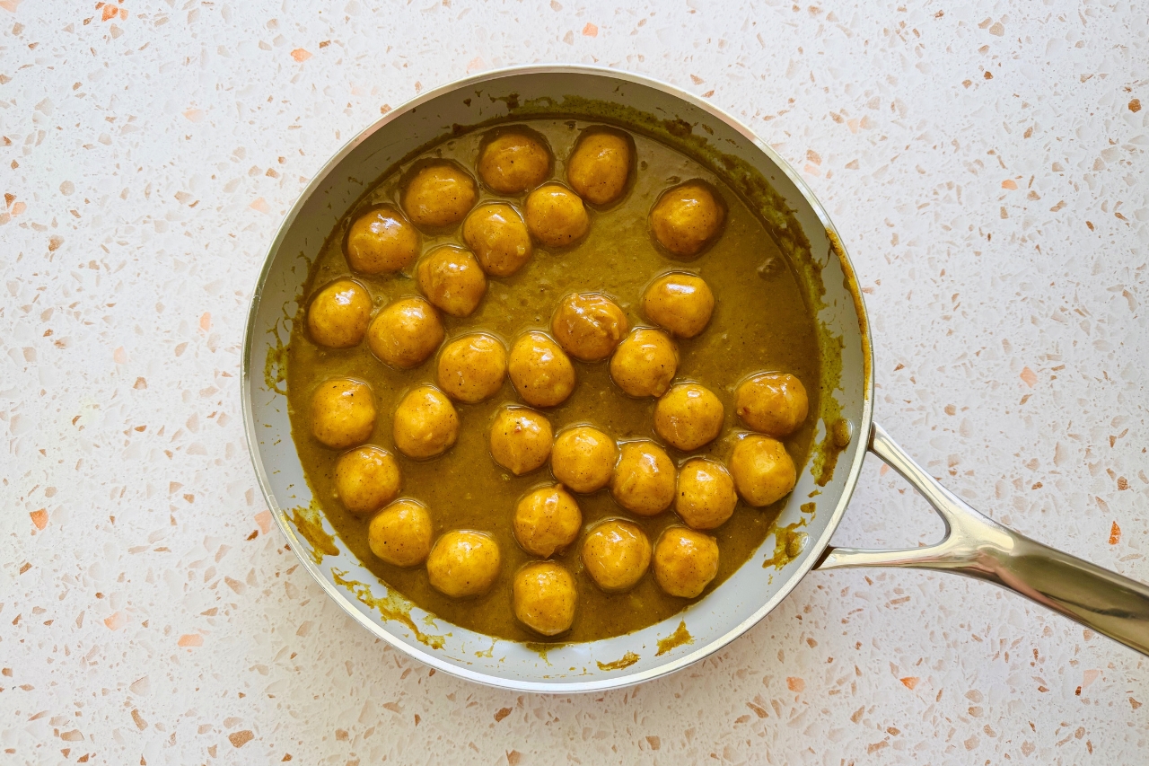 Curry fish balls in pan