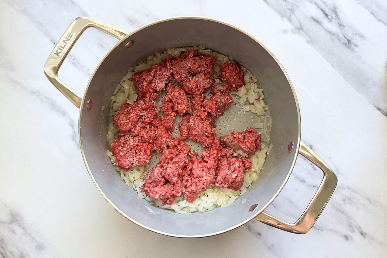Ground beef added to pot for lasagna soup