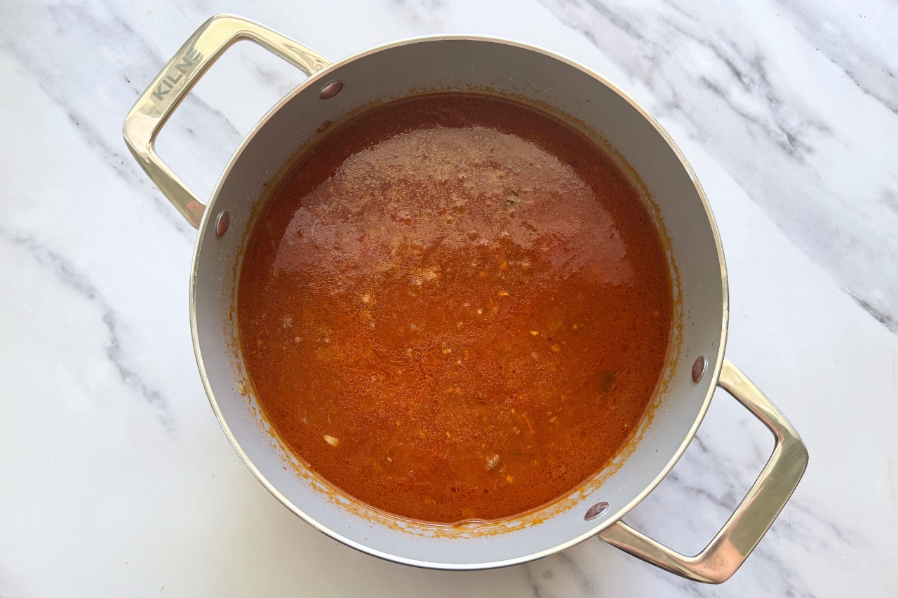 Marinara sauce and beef broth added to pot for lasagna soup