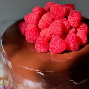 Chocolate Mirror Glaze Cake with Raspberry Coulis